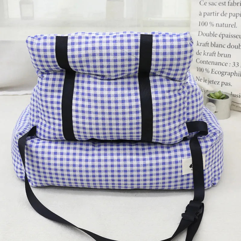 Car-mounted pet travel nest in grey and blue plaid colours showing stain-resistant cloth construction
