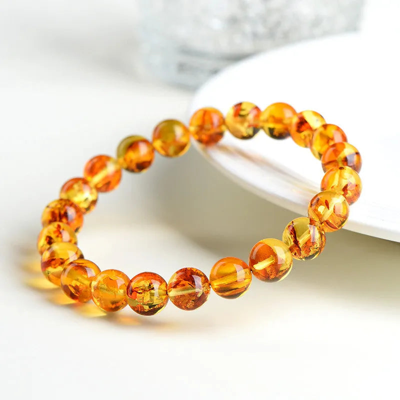 Natural yellow piebald amber bracelet with geometric polished beads for water purification