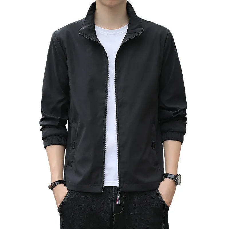 Man wearing a black Korean-style loose lapel casual jacket with zipper pockets.
