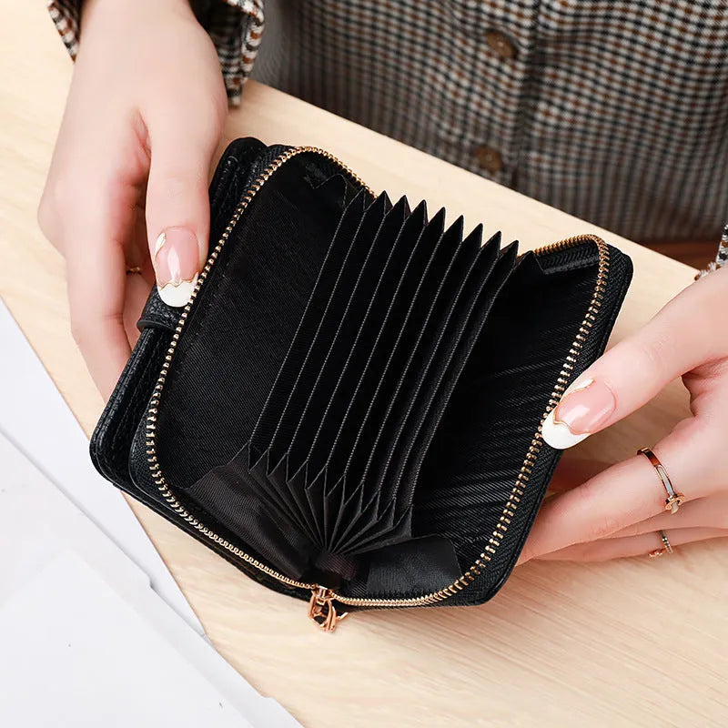 Ladies' short two-fold wallet with textured lychee pattern in beige, pink, black, and red colour options.