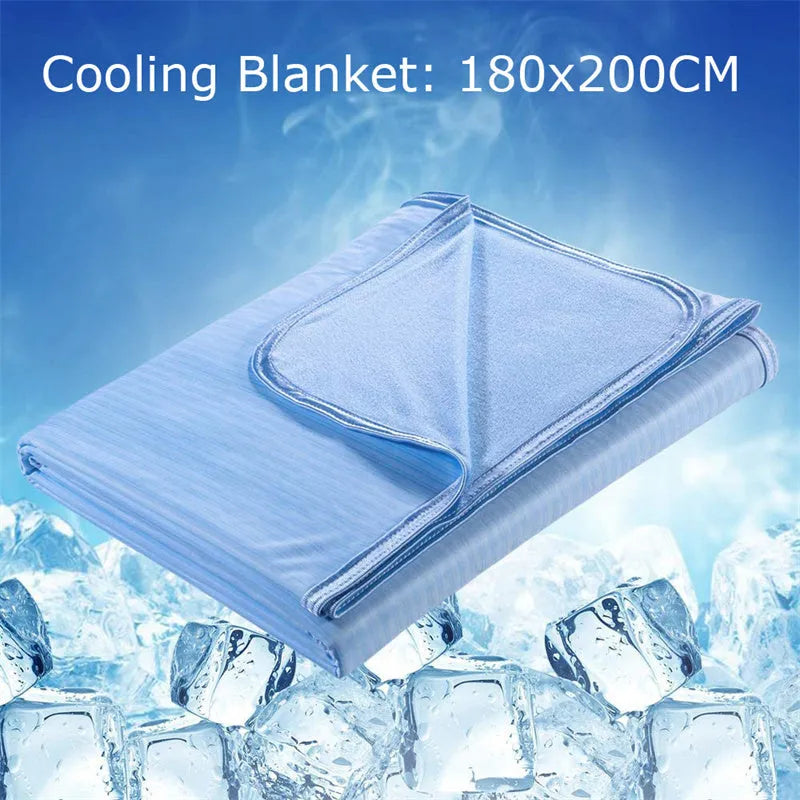 Blue cooling blanket with double-faced texture on a bed, showing its lightweight drape.