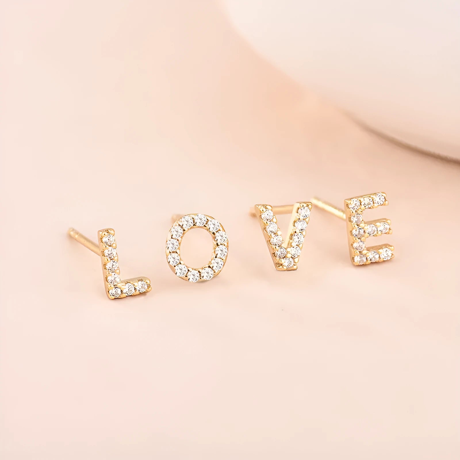 Brass gold plated alphabet letter earrings with zircon detailing showing single letter personalisation