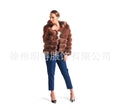 Loose-fitting women's hooded coat in artificial fur, shown in brown colour, with street fashion style.