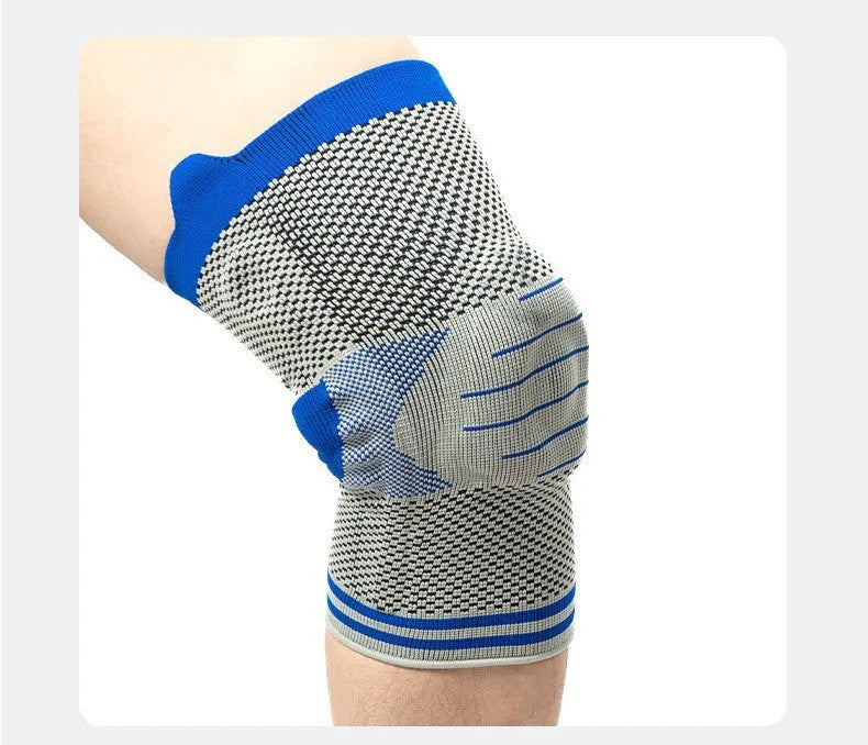 Cotton knee pad with silicone massage spring bar shock absorber in a black and blue colour combination.