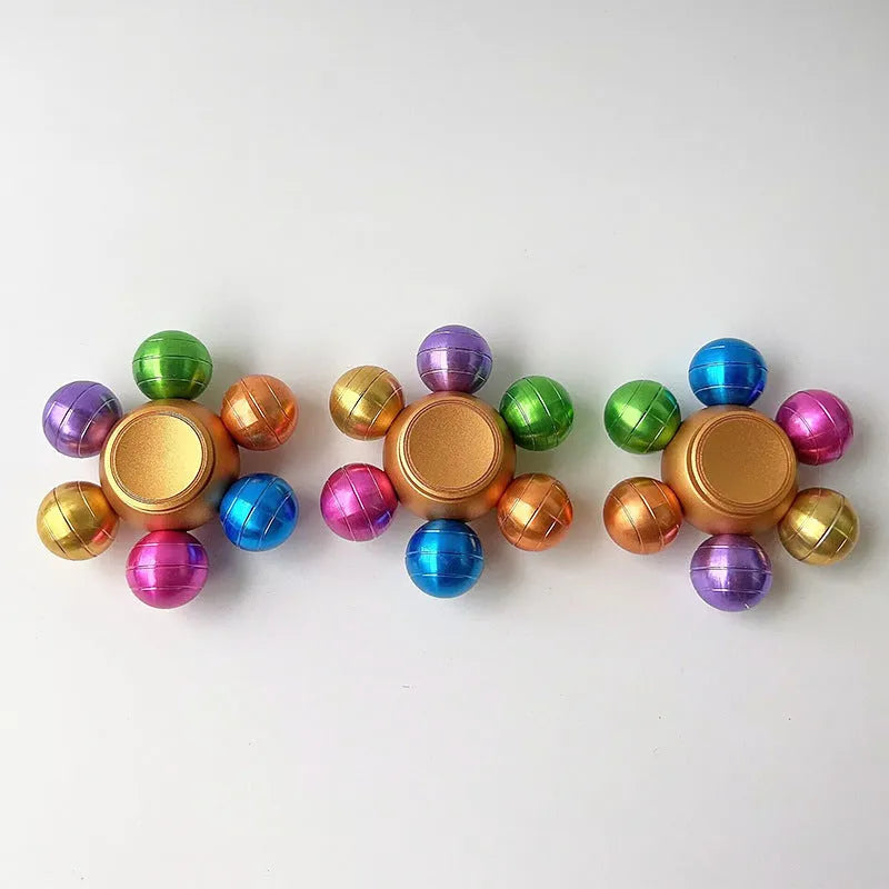 Colourful six Dragon Ball six-bead fingertip gyro in zinc alloy with metal bearing, approximately 6 x 2.2 cm