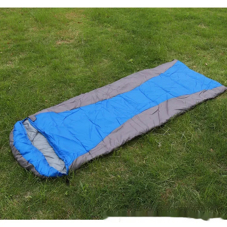 Envelope sleeping bag in orange and gray colour for camping and outdoor travel
