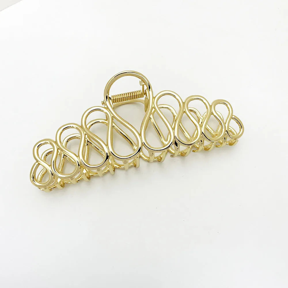 Large minimalist alloy hair clip with tassel detailing in gold or silver finish for women's updos