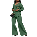 Women's brown suede velvet two-piece casual suit with long sleeves and trousers on a hanger.