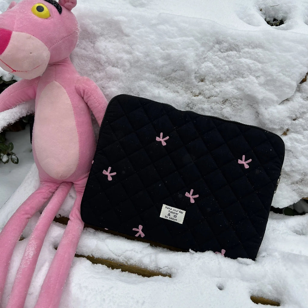 Cute rhombus embroidered bow laptop storage bag in nylon, shown in light pink colour.