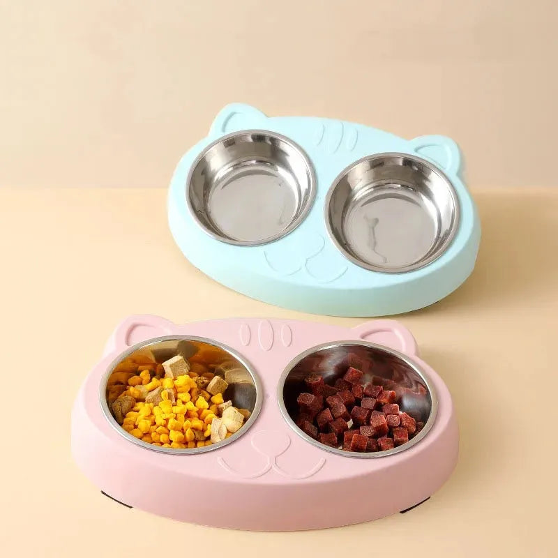 Blue Macaron double bowl plastic pet feeder for cats and dogs on a floor.
