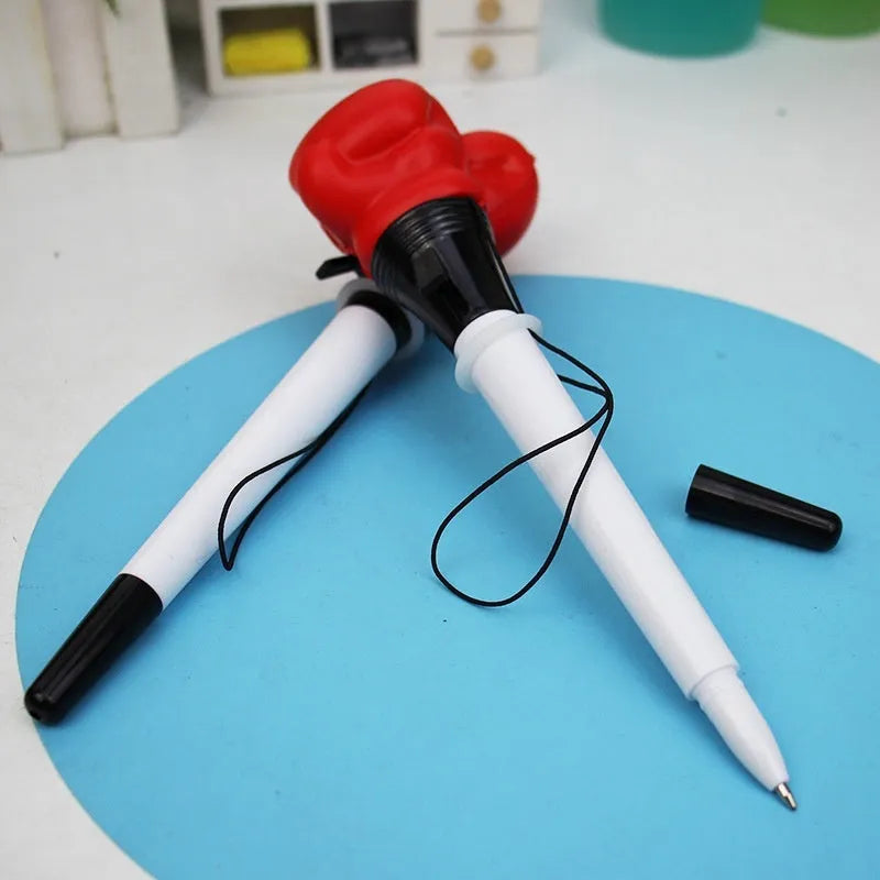 Four pressure relief pens with boxing ejection mechanisms and black ink refills