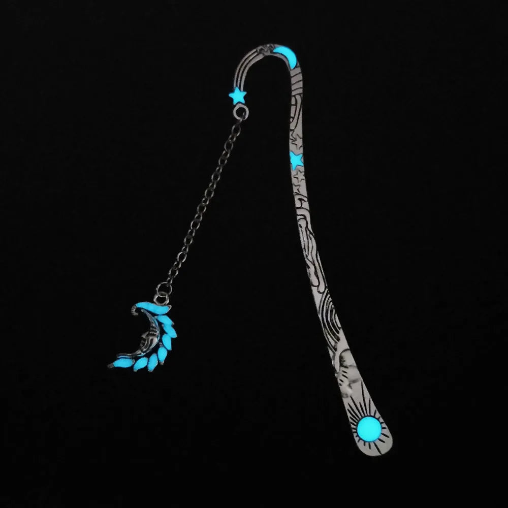 Retro five-pointed star glowing metal bookmark in ancient silver or bronze with sun, moon and stars design