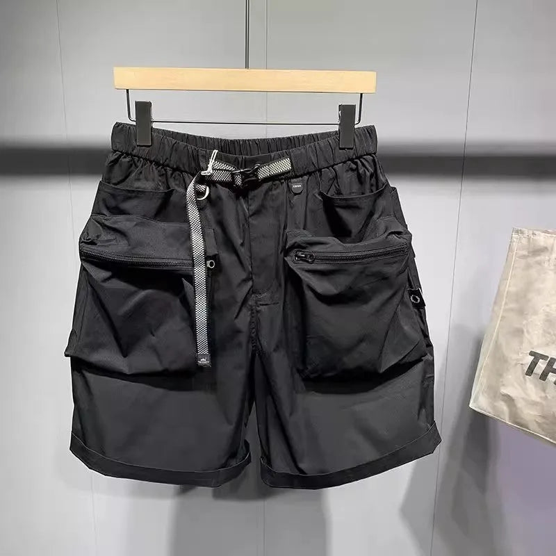 Men's loose fit workwear shorts in black or grey with pockets and straight leg hem available in large sizes
