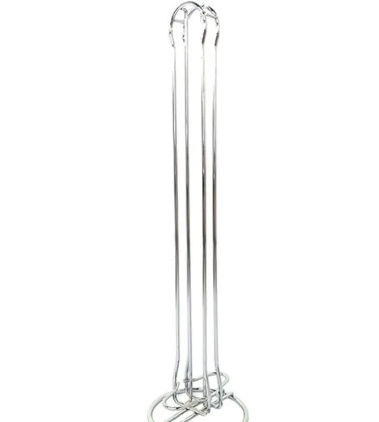 Wrought iron coffee capsule storage rack holding pods on display shelves