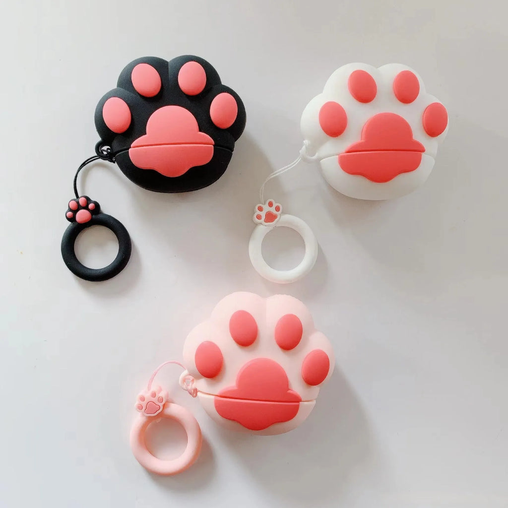 Cat's paw silicone earphone case for Apple AirPods, cute cartoon design, available in black, pink, or white.