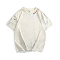 Gray tie dye T-shirt with all-over paint print design, loose fit with short sleeves and round neck