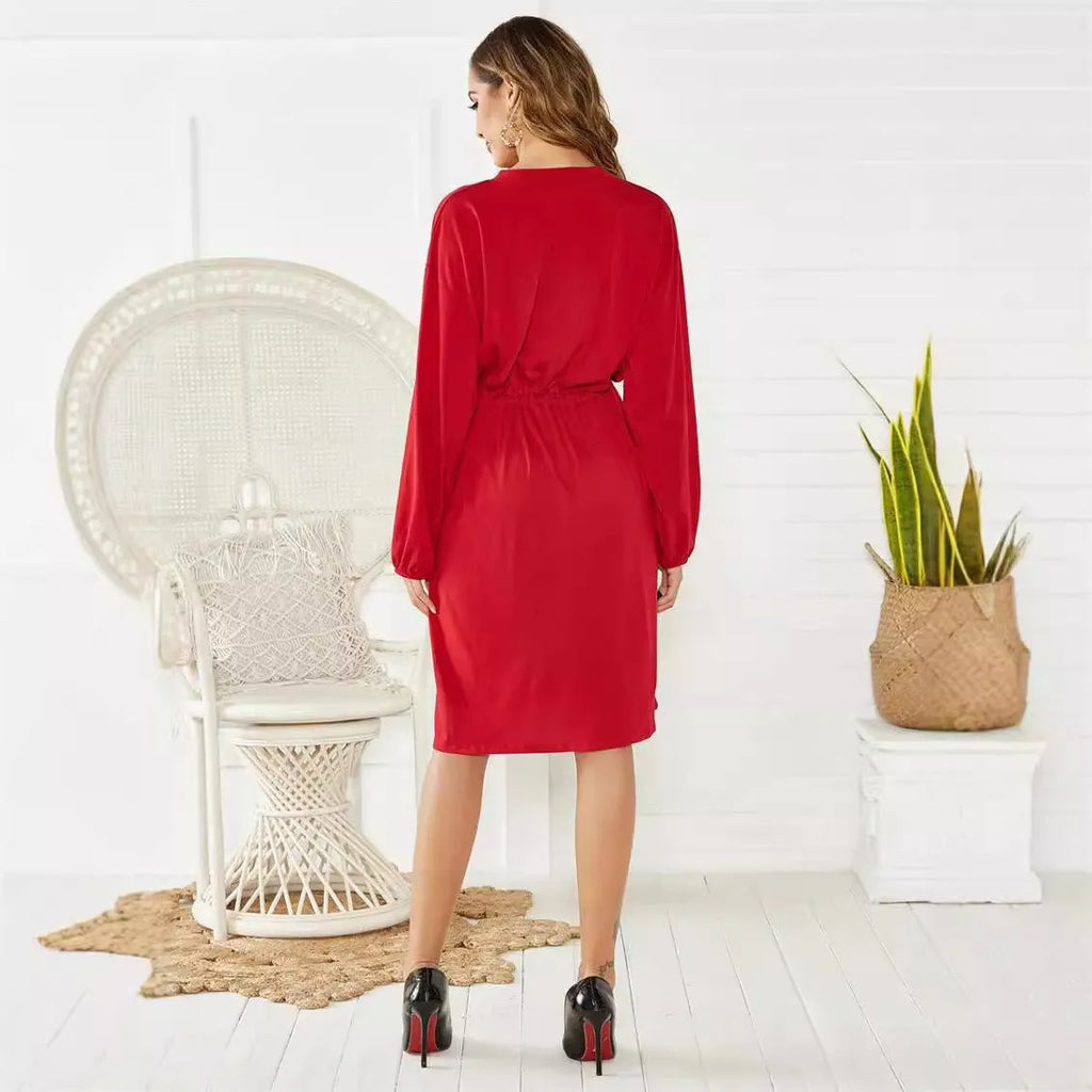 Black or red woven polyester dress with elastic waist, long sleeves, elastic cuffs, and a belt.