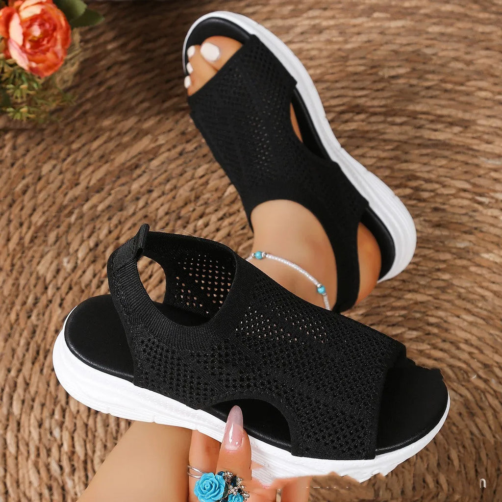 Women's platform sports sandals in pink with a flat head toe bracket and rubber sole