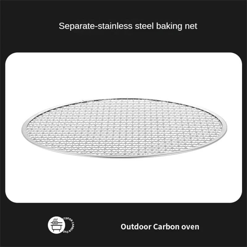 Portable stainless steel charcoal barbecue grill with removable legs and storage bag for outdoor use.