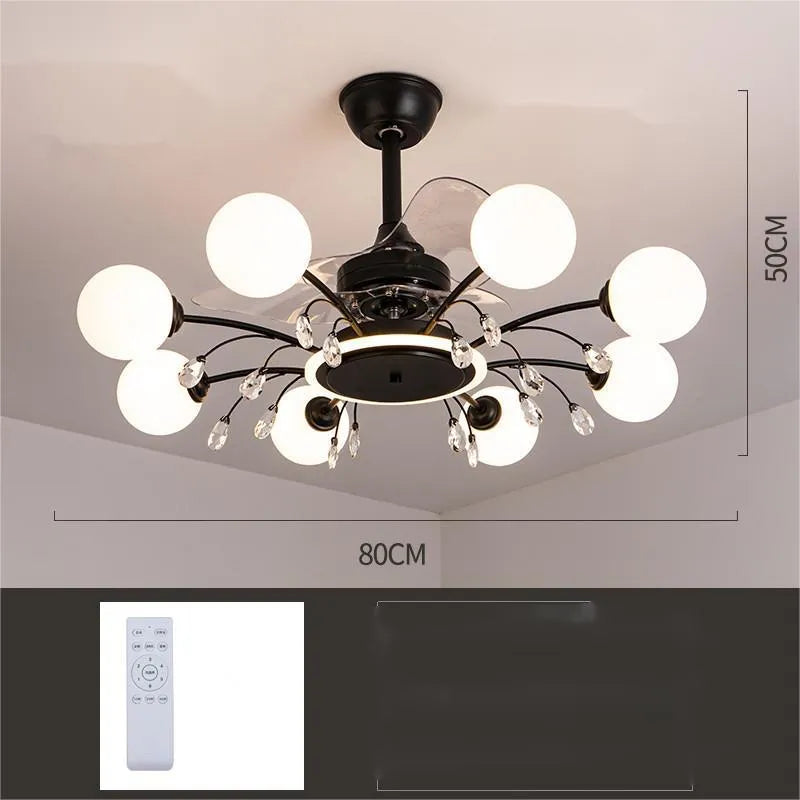 Black and gold ceiling fan light fixture with acrylic shade and metal blades, shown with remote control