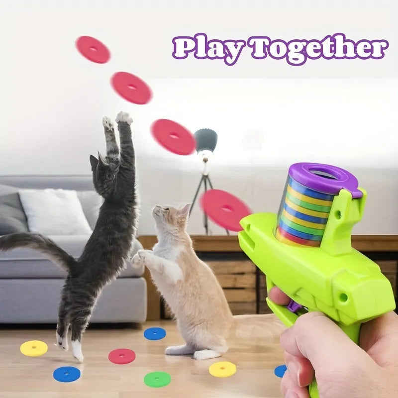 Interactive cat toy launcher with foam discs in green and purple colour options