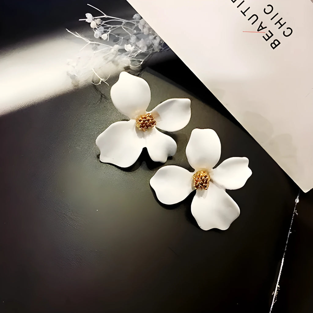 A pair of floral-shaped stud earrings for women, shown in alloy with an electroplated finish in white or pink colour.