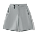 Men's solid colour sport shorts with elastic waistband, shown in army green, for running and climbing activities.