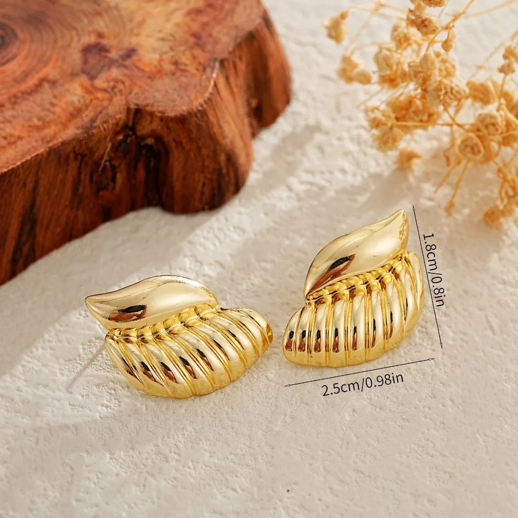 Pair of gold threaded water drop earrings for women on white background
