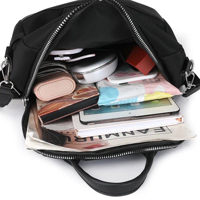 Large capacity black PU commute backpack with three-dimensional pockets and soft construction