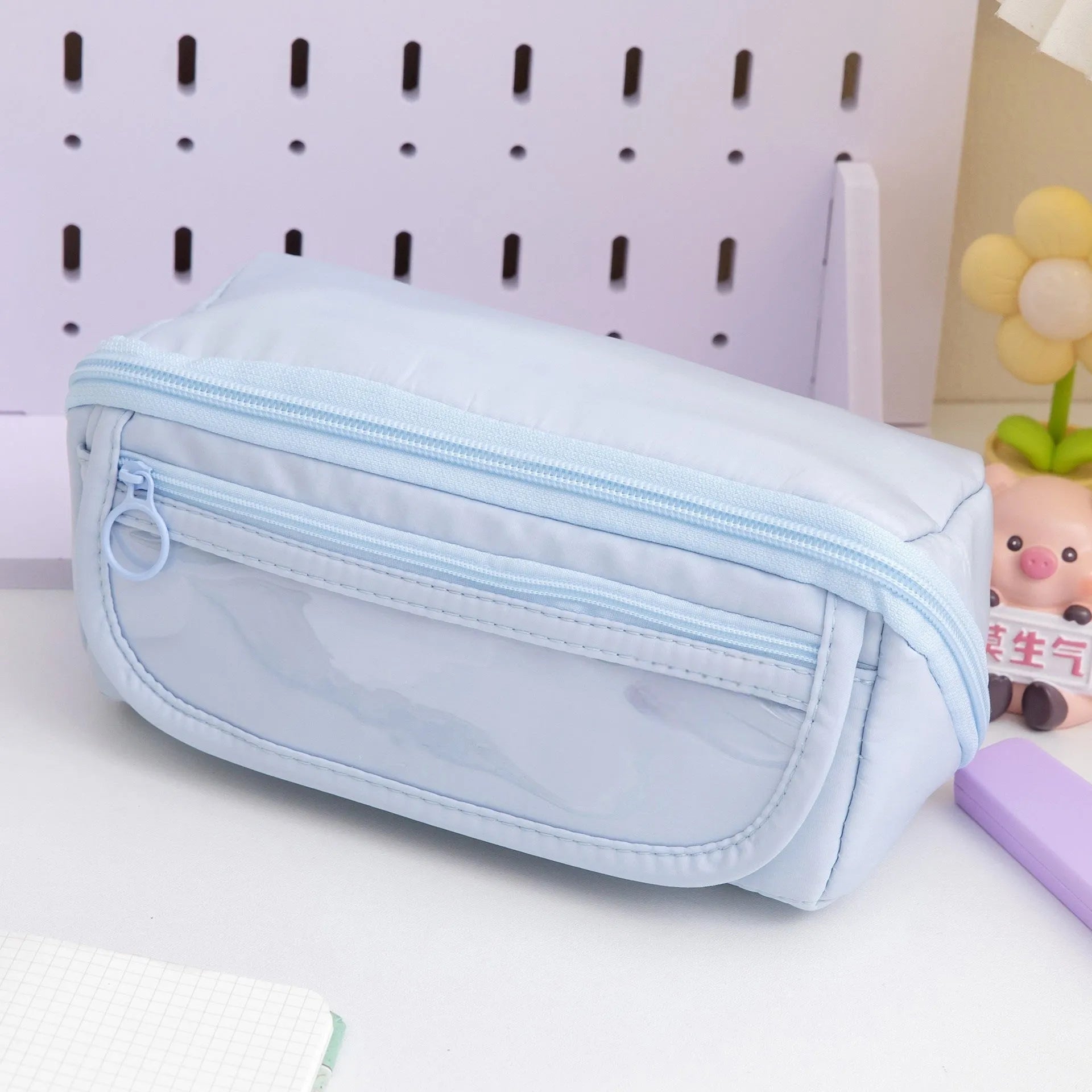 Korean style canvas pencil case with ten-layer flip design open to show multiple pen compartments.