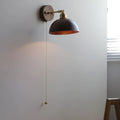 Nordic style wooden wall-mounted bedside lamp in walnut colour.