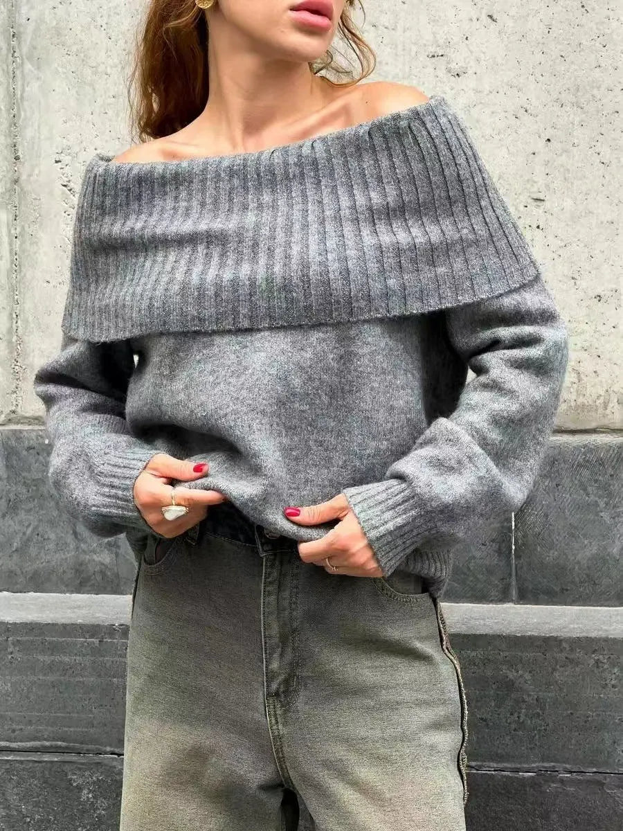 Grey off-the-shoulder strapless sweater with a raised 3D pattern texture.