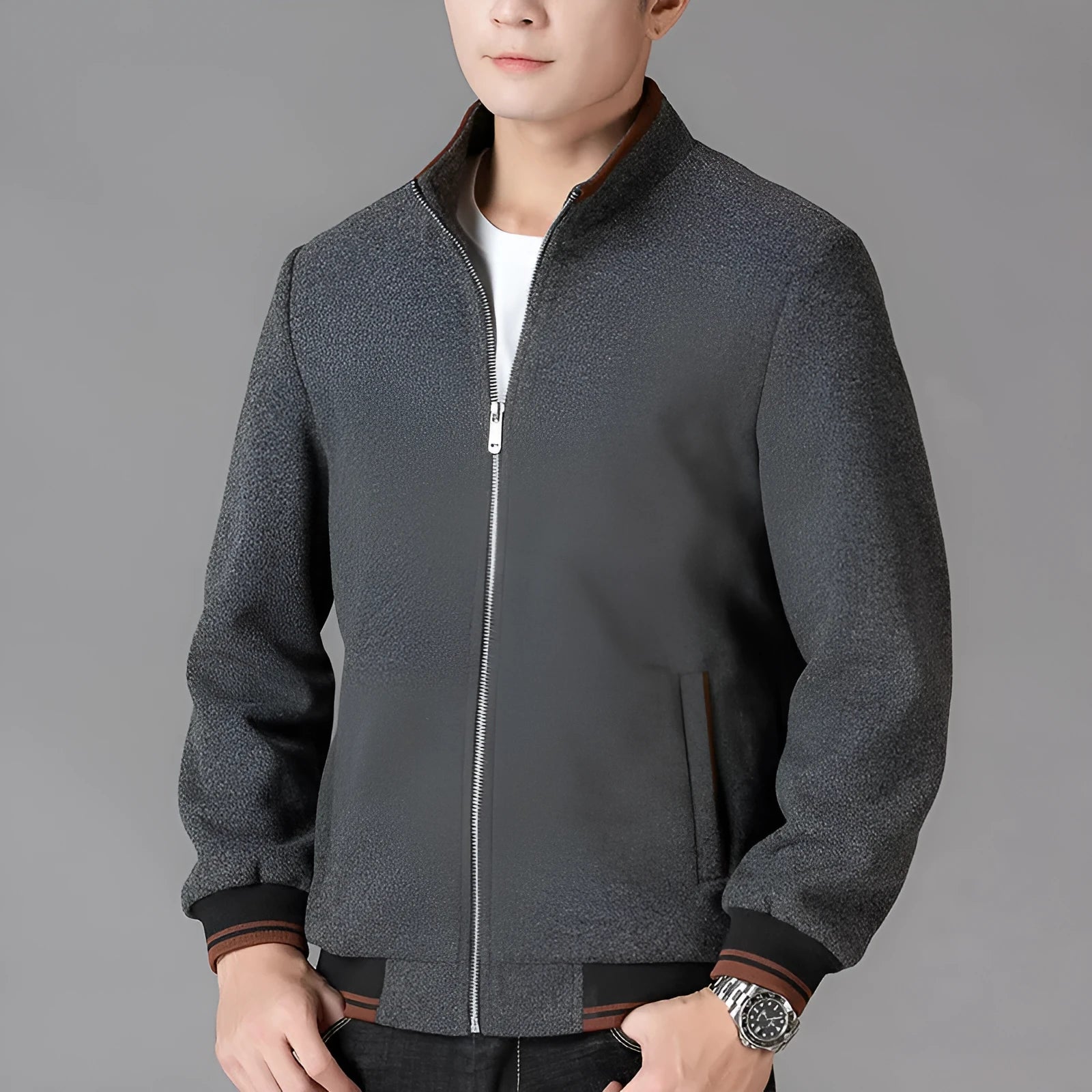 Men's grey sport-style fleece jacket with long sleeves on a hanger.