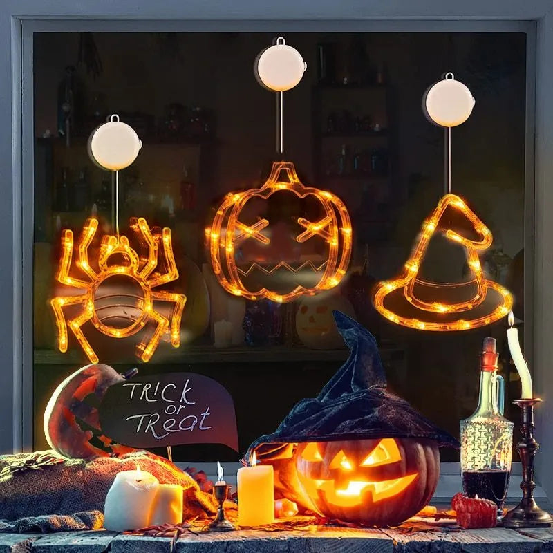 Halloween LED window lights showing spider, pumpkin and ghost designs with suction cup mounting