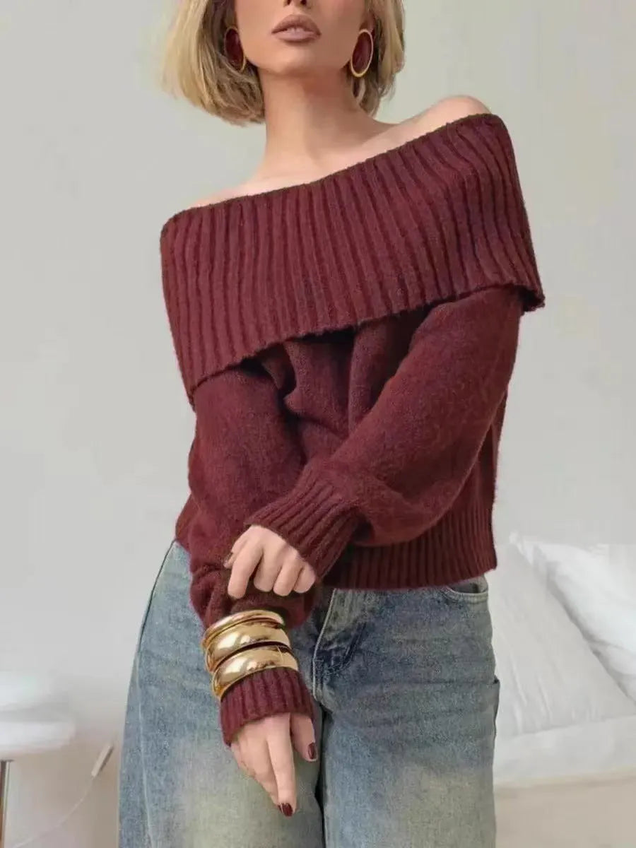 Grey off-the-shoulder strapless sweater with a raised 3D pattern texture.