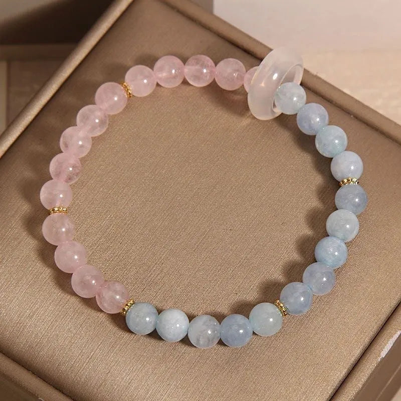 Women's aquamarine crystal bracelet set with pink beads and mixed materials in dopamine colours