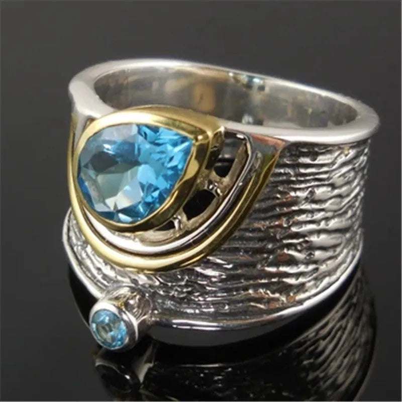 Blue zircon ring with drop shape design and Chinese style influences