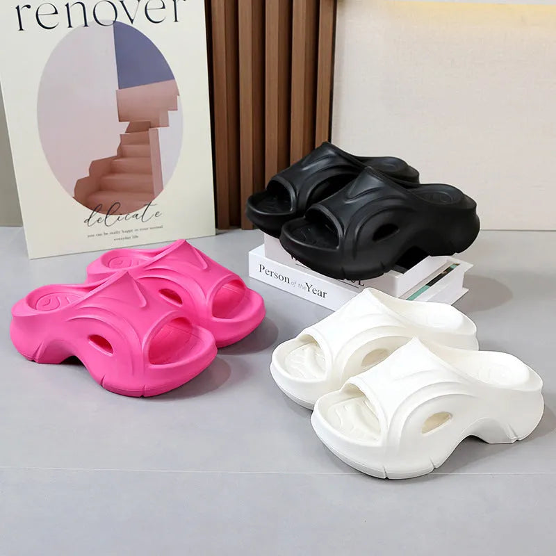 Women's white thick-soled EVA slippers with round toe on a beach background