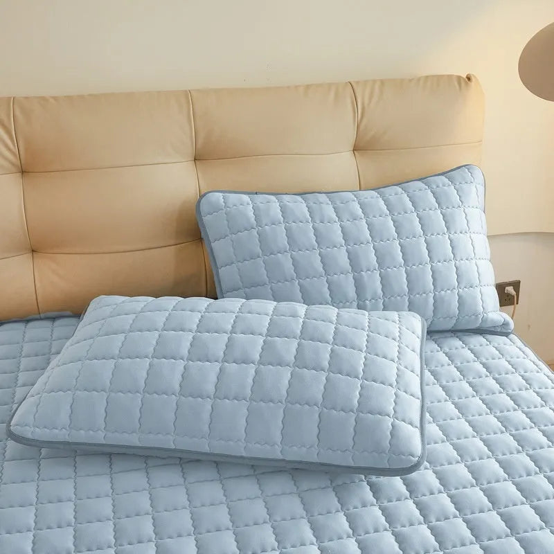 Waterproof washed cotton fitted sheet for bed protection in blue, shown on a UK double mattress.