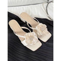Women's square toe sandals with satin upper, floral chunky heel, in cream-white colour.
