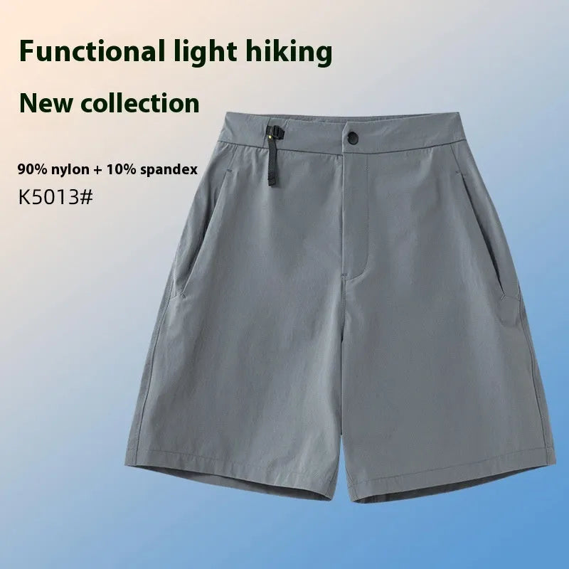 Men's solid colour sport shorts with elastic waistband, shown in army green, for running and climbing activities.