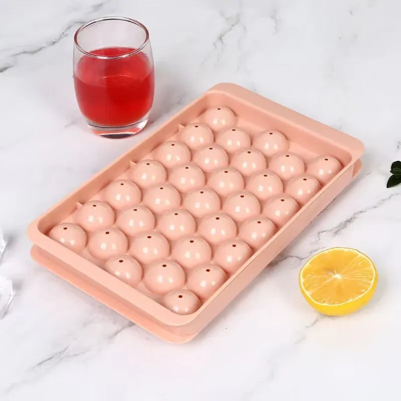 Blue silicone ice cube tray with lid showing 33 round grids for homemade ice