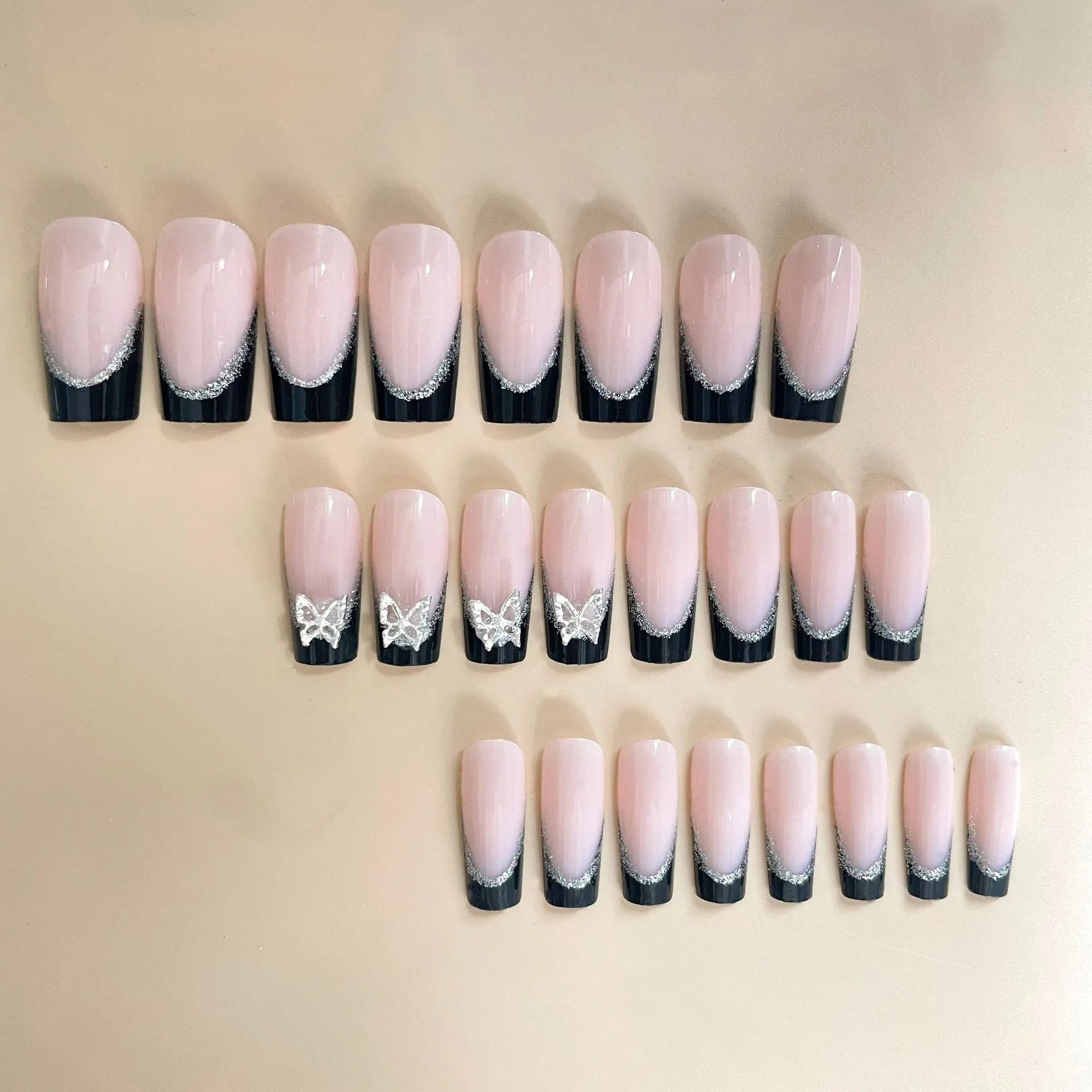 Black French style glitter butterfly nail wear armor set on a nail, showing yellow and black jelly glue colour options.