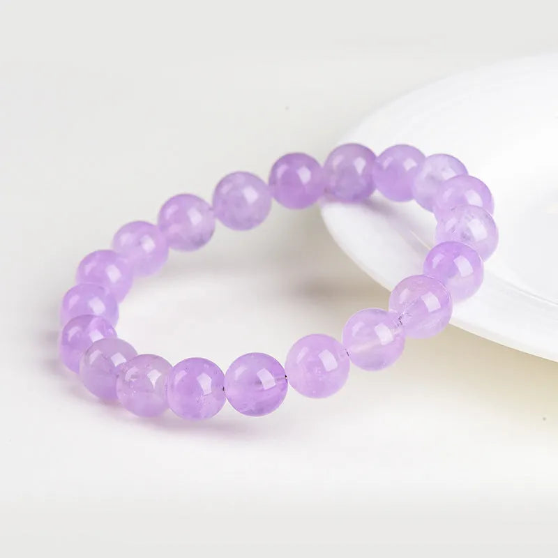 Lavender round bead amethyst bracelet with water ripple design, shown in cream and transparent colour options.