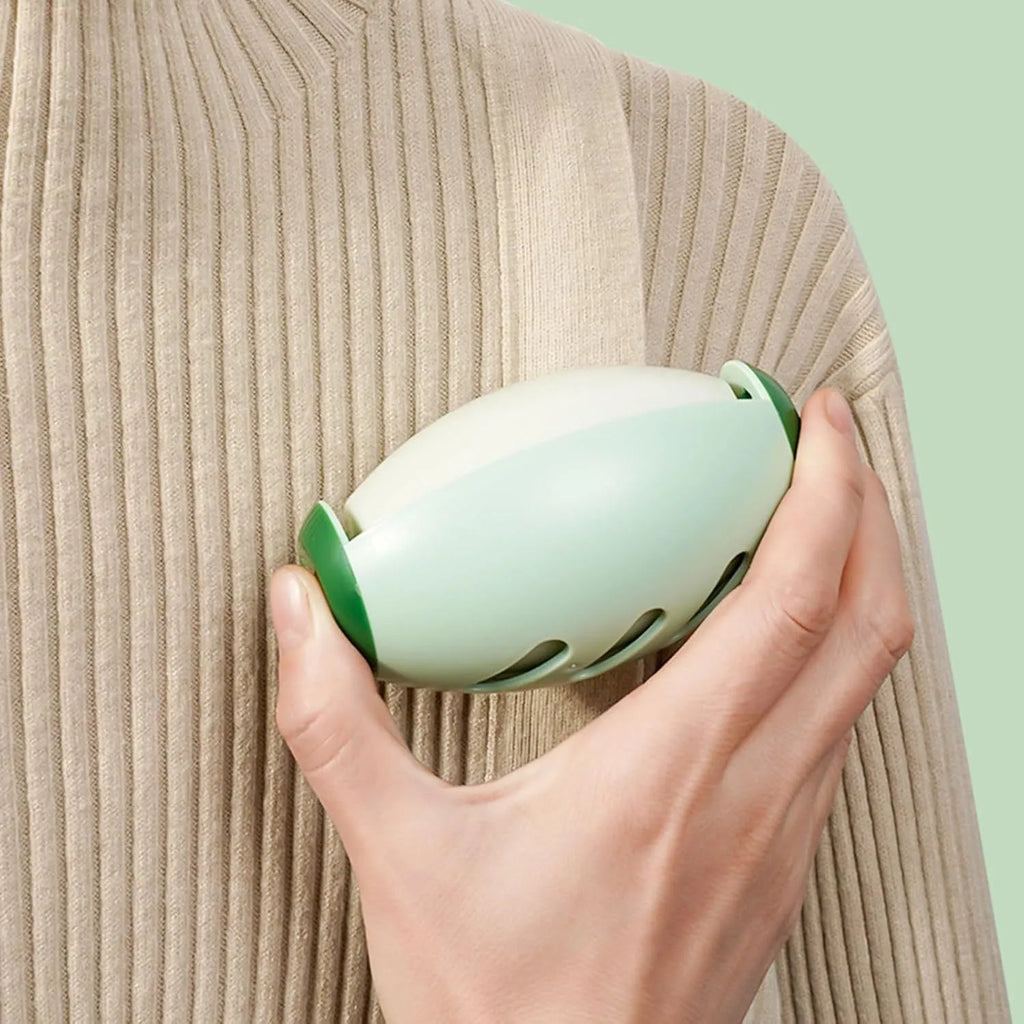 Green reusable gel lint roller ball for pet hair removal from fabrics