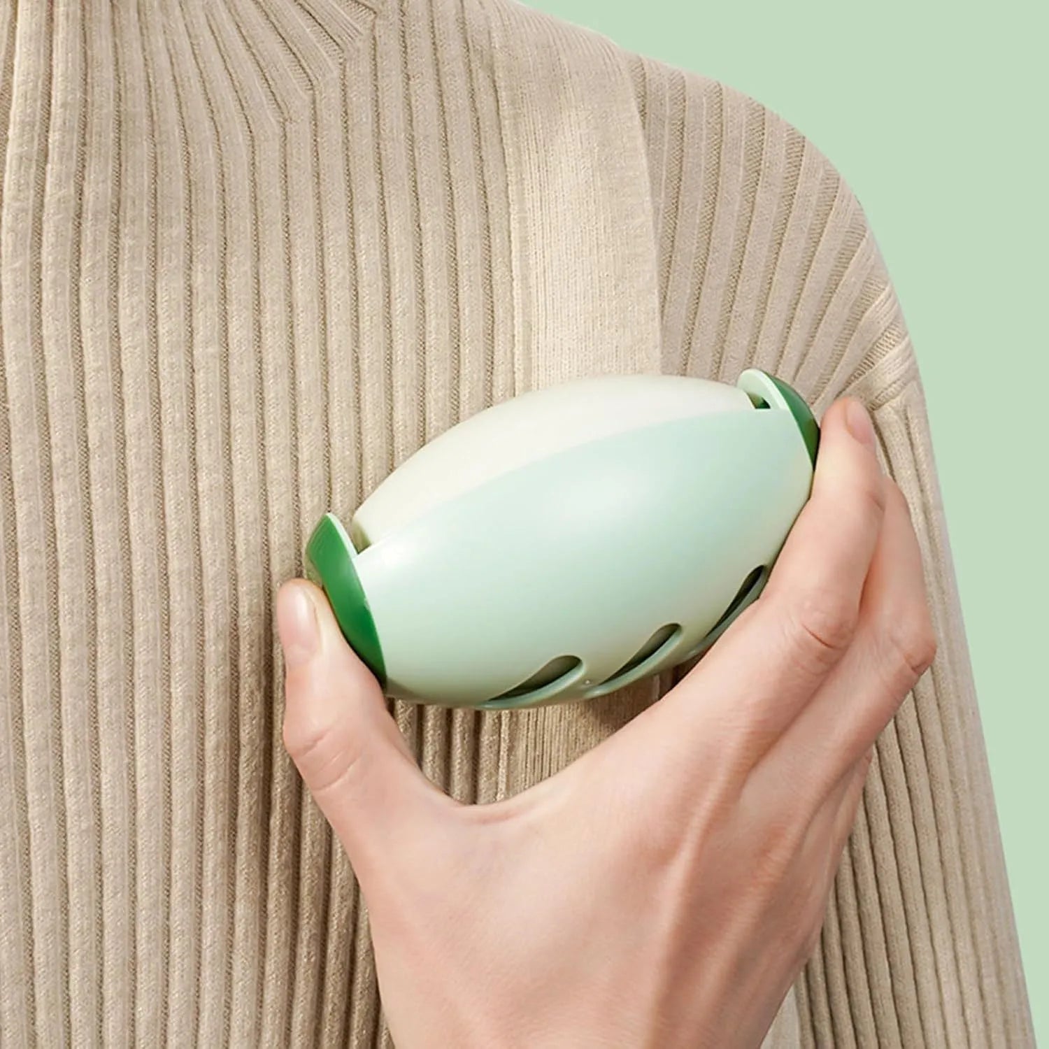 Green reusable gel lint roller ball for pet hair removal from fabrics