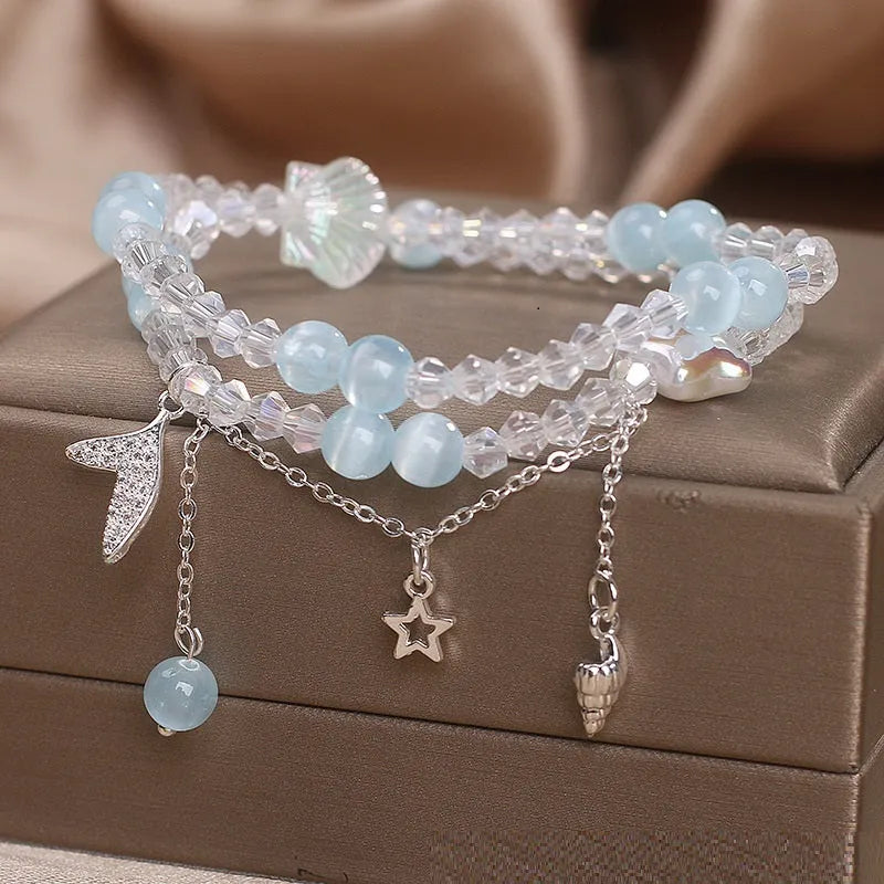 Light blue double circle aquamarine bracelet for women with two interlocking rings.
