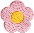 Flower-shaped silicone licking mat for dogs and cats with suction cups on the back.