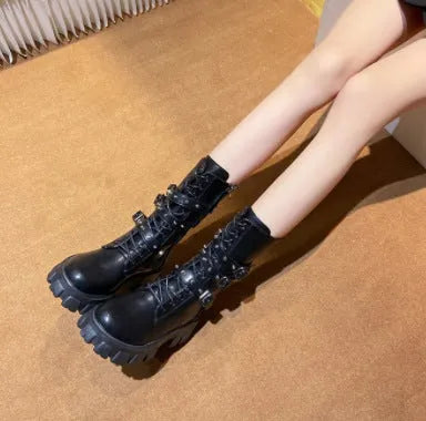 Women's black mid-calf knight boots with side zip and metal buckle details on artificial PU upper