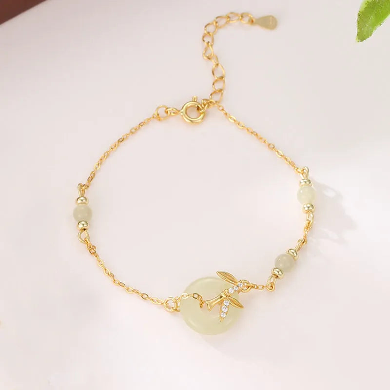 Women's antique style silver bracelet with a peace buckle and safety clasp in gold or silver finish.